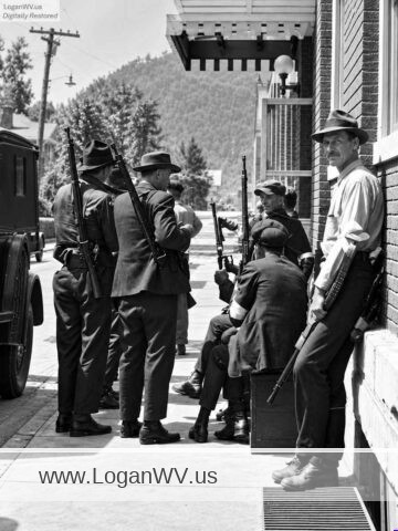 Photo of armed anti-union deputies outside the Aracoma Hotel, Logan, WV, during the 1921 Battle of Blair Mountain.