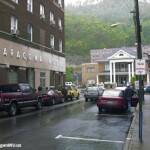 1999 Cole Street showing the Aracoma Hotel, Pioneer Hotel and the Honaker Funeral Home with Brady Thompson next to the Aracoma Hotel and his grandson JR getting in the car. 1999 Cole Street showing the Aracoma Hotel, Pioneer Hotel and the Honaker Funeral Home with Brady Thompson next to the Aracoma Hotel and his grandson JR getting in the car.