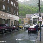 1999 Cole Street showing the Aracoma Hotel, Pioneer Hotel and the Honaker Funeral Home with Brady Thompson next to the Aracoma Hotel and his grandson JR getting in the car. 1999 Cole Street showing the Aracoma Hotel, Pioneer Hotel and the Honaker Funeral Home with Brady Thompson next to the Aracoma Hotel and his grandson JR getting in the car.