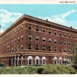 The Aracoma Hotel was built in 1917. This postcard was postmarked in Logan on Nov. 23, 1937. The card was published by the Guyan Drug Company. Note the top of the old cars behind the hedges on Main Street. The photo for the card was taken from the area of the Judge Wilkinson home which later became the Harris Funeral Home and is currently the Honaker Funeral Home. Image 147. Aracoma Hotel postcard circa 1930, Logan, WV,
