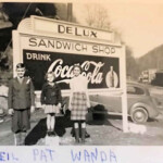 1938 - Foot of Man Hill looking up back street. The Delux Sandwich Shop was beside the Theater which was across the street to the right in this photo. The children are Neil Robison, Pat Bowman (Weir), Wanda Bowman (Cashion). Courtesy of Paula Solar. 1938 DeLux Sandwich Shop, Man, WV Neil Robison, Pat Bowman (Weir), Wanda Bowman (Cashion)