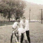 Bent over is Donnie Runyon left is Jim Lawson. John Hylton is playing QB. Courtesy of G. B. Berry. Donnie Runyon, Jim Lawson and John Hylton at Monaville, WV