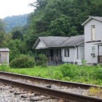 My grandpa's house and their neighbor´s house, the Haslams. The grade school is gone and nature is reclaiming the land. Courtesy of G. B. Berry. Monaville, WV