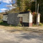 Courtesy of Dwight Williams. He writes. It is July in the 1970s and it is hotter than the gates of hell. You take your vehicle to this little car wash at Stollings because of whose doing the cleaning. Three lovely girls clad in two piece bikinis. Traffic is backed up waiting and watching. Butch Kazee knew how to make money. I just wish I had a vehicle back then. Image 1894. Photo of the old Stollings Car Wash, Logan County, WV.