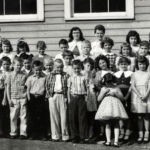 Photo courtesy of John Paul Curry. Dorothy Spiech-Baisden writes. Front row, from right: Debbie Pack (I think), Brenda Craddock Bennett, me, and Linda Lambert Waugh. Adults in back row on right: Tooky Craddock, Gloria Martin (our second grade teacher), and my mother, Susie Spiech. It was the spring of 1957 or 1958. We were either in the second or third grade, and this was our annual field trip to Charleston. On the back row, second from left was Allie Vance, the Principal. Valerie Mann also write. My mom, Roberta (Bobbie Ann) Bell Mann is the 5th adult from the left. Henlawson Grade School, Henlawson, Logan County, WV