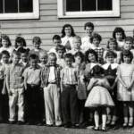Photo courtesy of John Paul Curry. Dorothy Spiech-Baisden writes. Front row, from right: Debbie Pack (I think), Brenda Craddock Bennett, me, and Linda Lambert Waugh. Adults in back row on right: Tooky Craddock, Gloria Martin (our second grade teacher), and my mother, Susie Spiech. It was the spring of 1957 or 1958. We were either in the second or third grade, and this was our annual field trip to Charleston. On the back row, second from left was Allie Vance, the Principal. Valerie Mann also write. My mom, Roberta (Bobbie Ann) Bell Mann is the 5th adult from the left. Henlawson Grade School, Henlawson, Logan County, WV