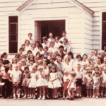 Photo courtesy of Dave Seafler. He writes. I am trying to identify some of the people in the attached photo. I think this was our VBS at Justice Christian Church in 1961 or 62. My dad (Grover Seafler) was the minister at the time and I think he took the picture. Mom (Gladys) is in the picture (upper left, second from top with white necklace). I can identify my brother Bob, Stanley, Simon and the Darbys. If you can identify anyone, please leave a comment. (246891) Justice Christian Church, Logan County, WV