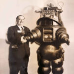 Wayne Mathia and Robby the Robot courtesy of his grandson, Robbie Mathis. Wayne Mathis was the principal owner of Monitor Drive-In. Robby the Robot was sold for 5.3 million dollars in 2017. Wayne Mathis and Robby the Robot, Logan, WV