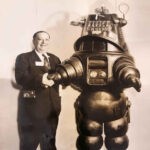 Wayne Mathia and Robby the Robot courtesy of his grandson, Robbie Mathis. Wayne Mathis was the principal owner of Monitor Drive-In. Robby the Robot was sold for 5.3 million dollars in 2017. Wayne Mathis and Robby the Robot, Logan, WV