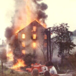 YMCA building burning taken July 4, 1978 while standing on the old bridge to Peach Creek. Courtesy of Jay Anna Ellis. July 4, 1978 Peach Creek YMCA burning