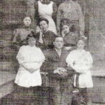 Wilbur Turnell and family. front: Mozell Turnell, Wilbur Turnell, Thelma Turnell
2nd row: Gertrude Turnell, Rebecca Turnell, Lena Turnell. 3rd row: Willie Steinbrecher (Rebecca's eldest sister) and Herman Turnell, son of Rebecca and Wilbur. Not certain about all of the names. If you see a mistake, please leave a <a href="https://loganwv.us/unknown-faces/#respond">comment</a>. Image 2238. Wilbur Turnell and family.