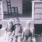 Center is Willie Thompson (1934-1976), the other two children are unknown. The photo was taken at Harts Creek around 1939. If anyone can ID the other two, please leave a <a href="https://loganwv.us/unknown-faces/#respond">comment.</a>. Image 2083. Willie Thompson (center)