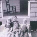 Center is Willie Thompson (1934-1976), the other two children are unknown. The photo was taken at Harts Creek around 1939. If anyone can ID the other two, please leave a <a href="https://loganwv.us/unknown-faces/#respond">comment.</a>. Image 2083. Willie Thompson (center)