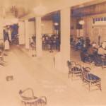 The YMCA lounge at Peach Creek. The Peach Creek YMCA opened in 1926. Message on back: “This is the lobby where Cy’s stand is. In corner marked (x) you will see Cy at his desk. The opening at that end leads into the Dining Room.” The YMCA lounge at Peach Creek.