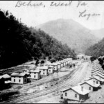 "Dehue Camp during 1917 – Peter Flanigan took this picture from a hillside above the Dehue Camp while it was still under construction. Except for the G P Harvey family residing in one of the houses on left, the houses were unoccupied. There was no electricity, outbuildings or fences for the row of houses on the right. The houses were being constructed concurrent with sinking the shaft and slope for the Dehue Mine. There were no Dehue Mine structures at this time, because the site contained only shaft and slope sinking structures. Walter F. Patterson, Jr. of Welch contracted sinking the shaft and slope. The vertical shaft at Dehue was the first in Logan County. Peter Flanigan was my grandfather’s (Daniel Flanigan) brother. Daniel was superintendent for sinking the shafts at Hemphill (McDowell County) during 1917." Courtesy of Richard Flanigan 1917 Dehue Camp courtesy of Richard Flanigan