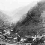 “Early aerial view of Dehue tipple taken by civil engineer Carl Paller who worked for Youngstown from 1927 to 1944. Dehue got its start in 1916, when Rum Creek Collieries and By Products sank a shaft and built surface buildings in the hollow along Rum Creek. Dehue was named after D.E Hewitt, who operated a large band mill in the vicinity. I am sure some of the timber used to build the houses for the miners to rent, came from the bare mountains behind.” Courtesy of Lillian Porter-Smith. 1920s Aerial View of Dehue
