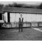 "Bill Godby with garages in the background which the company rented out." Courtesy of Lillian Porter-Smith. Bill Godby
