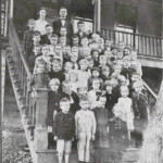 Photo courtesy of Lynn Skaggs Davis. Circa 1926, 1st Grade Class, Ethel School. Standing at the top is the teacher, Miss Clay and the Principal, R.H. Carder (my grandfather). 1926 Ethel Grade School, Logan County, WV