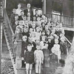 Photo courtesy of Lynn Skaggs Davis. Circa 1926, 1st Grade Class, Ethel School. Standing at the top is the teacher, Miss Clay and the Principal, R.H. Carder (my grandfather). 1926 Ethel Grade School, Logan County, WV