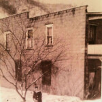 1945 Helen Piros at Cherry Tree on the side of the Handy Andy store building. Courtesy of Bob Piros. (35649) 1945 Helen Piros at Cherry Tree, Logan County, WV
