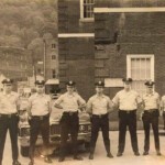 1972 City Police, Logan, WV courtesy of Sam Ball. (1) Bob Mathis (2) Sam Ball (3) Donnie Summers (4) ?
(5) Othar Bills (6) Russell Clark (7) Jerry Shell (8) David Townsend (9) Roger Pearson. Chief Tom Fink not shown. If you anyone can name number 4, please leave a comment. Ref. Image 1972. 1972 City Police, Logan, WV