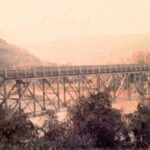 1976 Pecks Mill Bridge courtesy of Bob Piros. The bridge was built in 1927 and replaced in ?? The new bridge is named in honor of PFC Homer Douglas Nelson killed in Vietnam Oct. 28, 1965. 1976 Pecks Mill Bridge, Logan County, WV