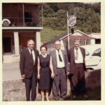 Clyde Taylor, Elizabeth Taylor Keathley, Jess Taylor and Ed Taylor taken at the funeral of their sister, Virginia Taylor McCormack. Oscar Sansom's Ashland Oil Station is in the background. Cherry Tree, WV