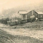 Courtesy of Dean Adkins - This is the home place of my mother, Manda Lou (Dean) Adkins in the “Dean Holler.” She is standing and holding my brother who just turned 80. My grandmother, Maude (Bradshaw) Dean is standing in the doorway. Wayne County, WV. Dean Hollow, Wayne County, WV