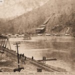 Postcard showing the flooding of the Mt. Gay area postmarked Logan May 30, 1908. Message on the back: “Here is a view of Gay Town one mile from Logan. See how the flood completely surrounded it. Sure was one of the worst floods for years in this county. We were shut off from every place for 15 days. With love to all, write soon. Raymond”. Image 78915. Mount Gay, Logan County, WV April 1, 1908