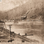 Postcard showing the flooding of the Mt. Gay area postmarked Logan May 30, 1908. Message on the back: “Here is a view of Gay Town one mile from Logan. See how the flood completely surrounded it. Sure was one of the worst floods for years in this county. We were shut off from every place for 15 days. With love to all, write soon. Raymond”. Image 78915. Mount Gay, Logan County, WV April 1, 1908