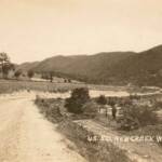 Real photo postcard veiw of US Route 50 at New Creek, WV. US Route 50 New Creek, WV