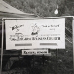 Tent revival meeting on vacant lot next to lot that would become the Pilgrim Holiness Church Tent revival meeting on vacant lot next to lot that would become the Pilgrim Holiness Church