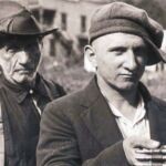 Miners at Blair giving up their guns at Blair after the Battle of Blair Mt. <br />Photo courtesy of Kenny King via Emmett Ray Adkins. miners and their sons giving up their weapons at blair at the endof mine war the battle of blair mt.