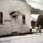 Pilgrim Holiness Church with Ray Smith in front of the church. Pilgrim Holiness Church with Ray Smith in front of the church.