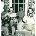 David Ryan playing guitar during WWII with his marine buddies.