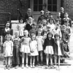 1st Grade 1942, Holden 22
Top L-R, Bernice Bias (dau. of 2nd Grade Teacher), Freddy Maynard, Tommy Curry, Robert Iceson
4th Row L-R, unidentified, Ronald Sisson, Bobby Bannister, James A. Bradshaw
3rd Row L-R, LaVerne Maynard, Billy Joe Patterson, Betty Burgett, June Maynard, Bobby Spaulding, unidentified
2nd Row L-R, Mrs. Virginia McCormack, James Doss, “Blackie” Evans, Donald Wright, Aldo Ardis, Richard Fields
Bottom L-R, Mildred Stewart (?), Ralph Maynard, Deloris Canterbury, Janice Elkins, Sandra “Shorty” Padgett, Treca Morehouse, Nadia Colliers, ? Colliers
“My mother, Virginia Taylor McCormack was the teacher. She left home in Cherry Tree before sunrise and arrived home after dark in the winter time.” Submitted by Robert E. McCormack <br />
Contest Entry #4 4 - 1st Grade 1942, Holden 22
