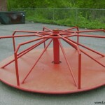 This merry-go-round was in service at the Justice Grade School for about fifty years. This picture was taken in 1999 and the merry-go-round was removed a year or so later. Merry-Go-Round