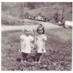 Neltha Maynard and Jenna Lou Chafin with the Island Creek Store # 28 in the background. Photo courtesy of Neltha Maynard Adkins. "Jenna was the daughter of our neighbors, Howard and Virginia Chafin. She had leukemia and never lived to go to school. She was my first BFF" Neltha Maynard and Jenna Lou Chafin