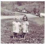 Neltha Maynard and Jenna Lou Chafin with the Island Creek Store # 28 in the background. Photo courtesy of Neltha Maynard Adkins. "Jenna was the daughter of our neighbors, Howard and Virginia Chafin. She had leukemia and never lived to go to school. She was my first BFF" Neltha Maynard and Jenna Lou Chafin