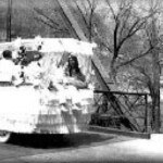 PARADE FLOAT CROSSING THE WATER STREET BRIDGE IN THE LATE 1930's PARADE FLOAT CROSSING THE WATER STREET BRIDGE IN THE LATE 1930's