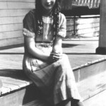 Virginia Taylor on the front porch of her home at Monitor, WV. Virginia Taylor on the front porch of her home at Monitor, WV.