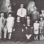 1925 portrait shows the family well established in Logan County, Alex sits at left, with Anna, Elizabeth, sister-in-law Anna, and daughters Virginia and Elizabeth also in the front row; sons Peter, Paul, brother Peter and Julia stand at rear. The Zekany Family in 1925, Henlawson, WV