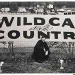 Willie Akers in front Wildcat Country Sign courtesy of Dwight Williamson. Willie Akers and Wildcat Country Sign, Logan, WV