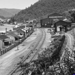 1920s Fanco Camp on Buffalo Creek outside of Man. Riley Camp is in the background upper left corner. Courtesy of Paula Solar. (Digitally restored. The original photo was too poor to read the tipple signs.) Photo of Fanco Camp on Buffalo Creek outside of Man, Logan County, WV.